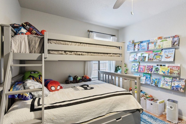bedroom featuring a ceiling fan and wood finished floors