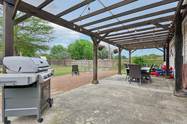view of patio with a fenced backyard, a pergola, outdoor dining space, and grilling area