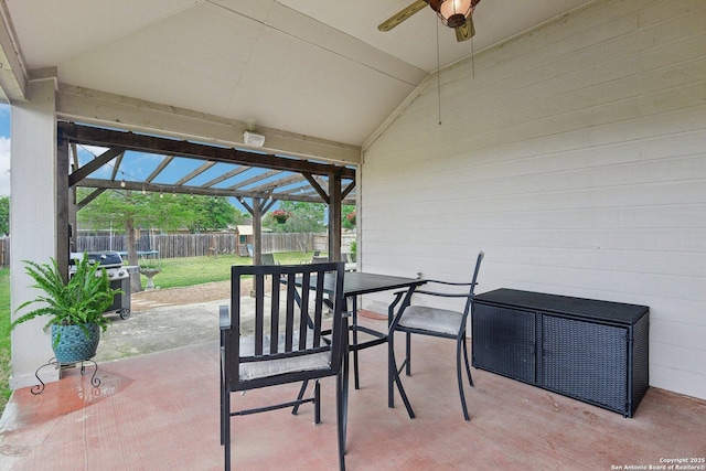 view of patio / terrace with grilling area, ceiling fan, a fenced backyard, and outdoor dining space