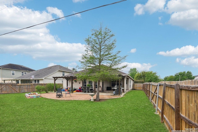 rear view of property with a pergola, a fenced backyard, a yard, and a patio