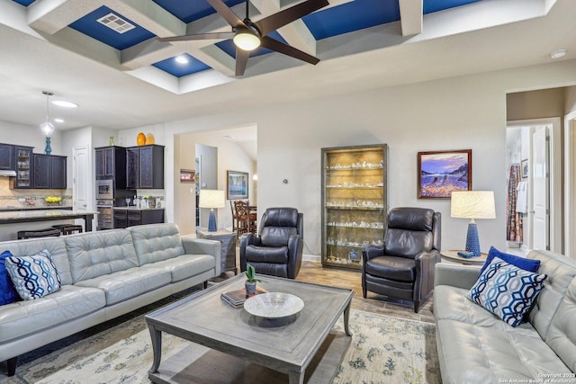 living room featuring a ceiling fan, coffered ceiling, beam ceiling, visible vents, and recessed lighting