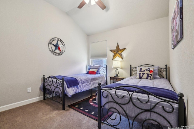 bedroom featuring ceiling fan, a textured wall, carpet, baseboards, and lofted ceiling