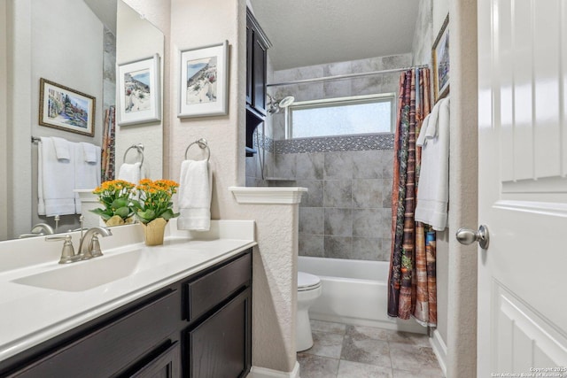 bathroom featuring toilet, baseboards, shower / bathtub combination with curtain, a textured wall, and vanity