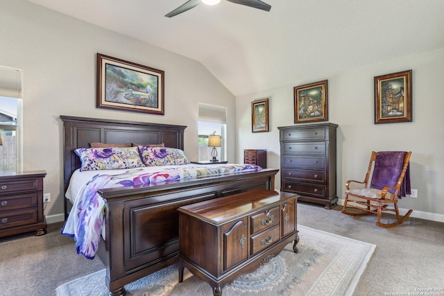 carpeted bedroom with vaulted ceiling, baseboards, and ceiling fan