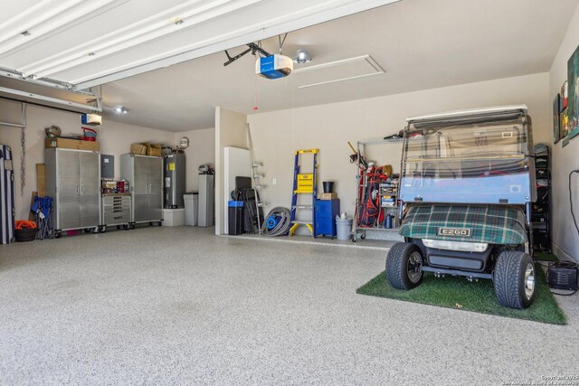 garage with water heater and a garage door opener