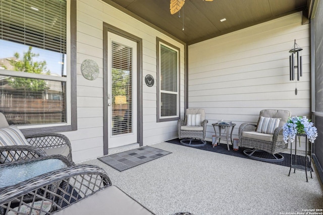 property entrance featuring ceiling fan and covered porch