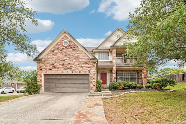 24915 Flying Arrow, San Antonio, TX 78258 - traditional-style house featuring concrete driveway, fence, brick siding, a balcony, and a front yard