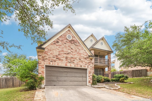 24915 Flying Arrow, San Antonio, TX 78258 - traditional-style house featuring a balcony, concrete driveway, fence, a garage, and brick siding