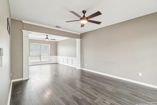 24915 Flying Arrow, San Antonio, TX 78258 - unfurnished room with ceiling fan, ornamental molding, dark wood-type flooring, and ornate columns