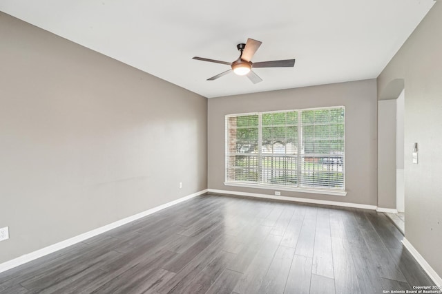 24915 Flying Arrow, San Antonio, TX 78258 - empty room with baseboards, a ceiling fan, and dark wood-style floors