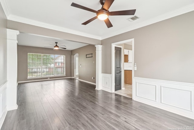 24915 Flying Arrow, San Antonio, TX 78258 - empty room with wood finished floors, a ceiling fan, visible vents, and ornate columns