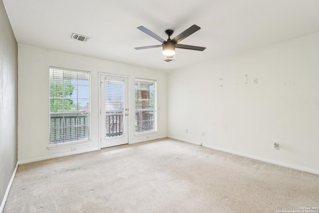 24915 Flying Arrow, San Antonio, TX 78258 - spare room featuring light carpet, a ceiling fan, visible vents, and baseboards