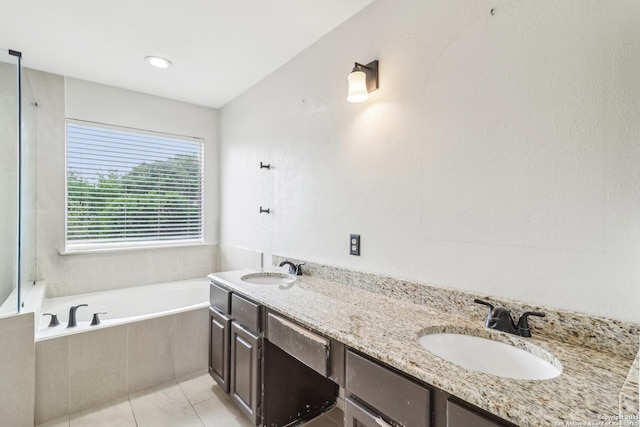 24915 Flying Arrow, San Antonio, TX 78258 - bathroom with tile patterned floors, a relaxing tiled tub, and a sink