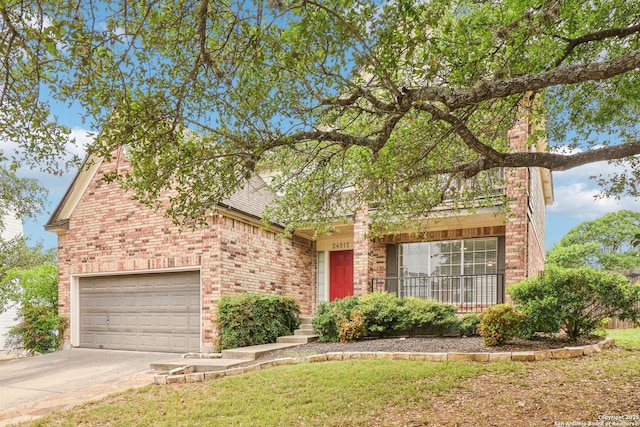 24915 Flying Arrow, San Antonio, TX 78258 - view of front of home with brick siding, an attached garage, driveway, and a front lawn
