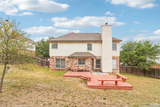 24915 Flying Arrow, San Antonio, TX 78258 - rear view of house featuring a fenced backyard, a chimney, brick siding, a deck, and a yard