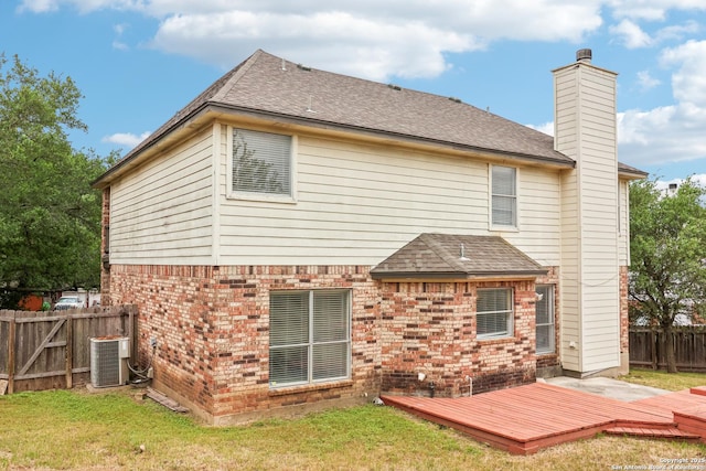 24915 Flying Arrow, San Antonio, TX 78258 - rear view of house with a wooden deck, brick siding, a fenced backyard, and a lawn