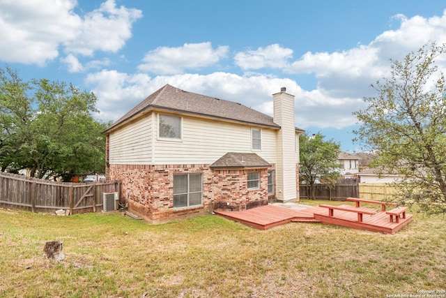 24915 Flying Arrow, San Antonio, TX 78258 - back of property with central AC, a lawn, a fenced backyard, a wooden deck, and brick siding