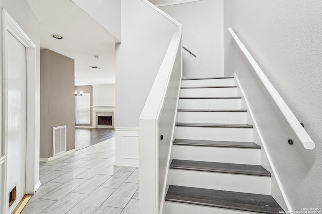 24915 Flying Arrow, San Antonio, TX 78258 - stairs featuring a wainscoted wall and visible vents