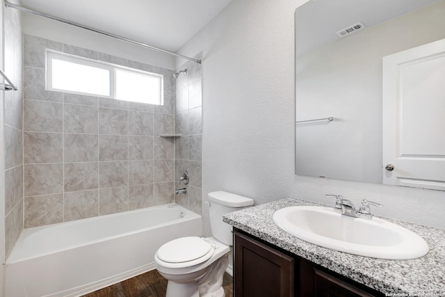 6551 Legato, San Antonio, TX 78252 - bathroom with wood finished floors, vanity, tub / shower combination, toilet, and visible vents