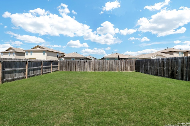 6551 Legato, San Antonio, TX 78252 - view of yard featuring a fenced backyard and a residential view