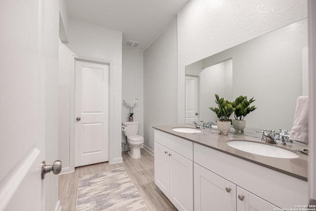 209 Wolf Crst, Seguin, TX 78155 - full bath featuring double vanity and wood finished floors