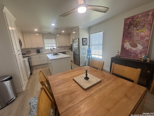 dining space with recessed lighting, light wood-type flooring, baseboards, and ceiling fan
