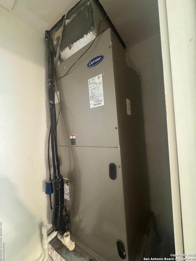 utility room with heating unit