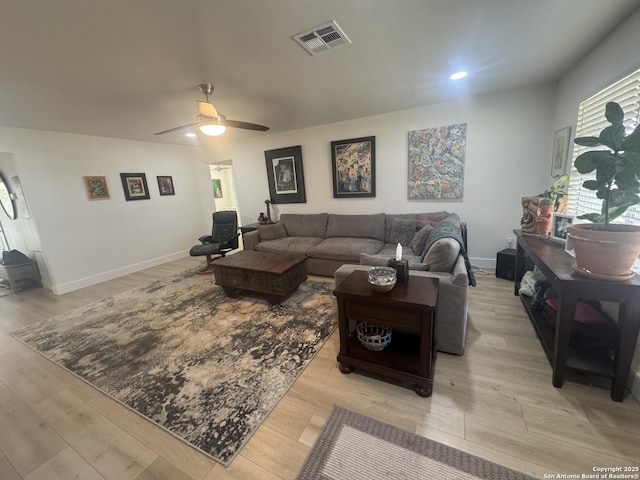 living room with ceiling fan, light wood-style flooring, baseboards, visible vents, and recessed lighting