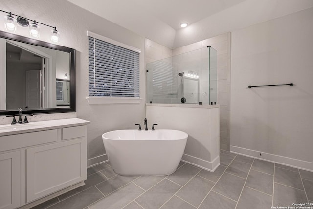 310 Vamanos, Boerne, TX 78006 - bathroom with tile patterned floors, a freestanding tub, vanity, baseboards, and a walk in shower