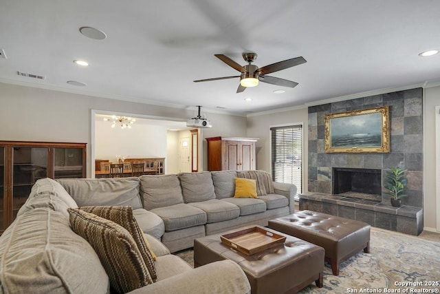 1815 Edgehill Dr, San Antonio, TX 78209 - living area with visible vents, recessed lighting, ceiling fan with notable chandelier, crown molding, and a fireplace