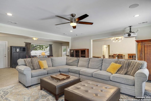 1815 Edgehill Dr, San Antonio, TX 78209 - living room with ceiling fan with notable chandelier, visible vents, light colored carpet, and crown molding