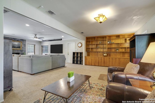 1815 Edgehill Dr, San Antonio, TX 78209 - carpeted living room with a ceiling fan, a large fireplace, visible vents, and recessed lighting