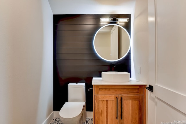bathroom featuring toilet and vanity