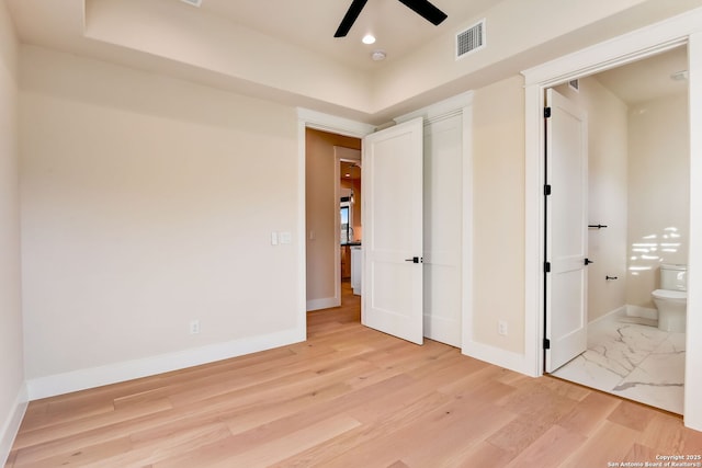 unfurnished bedroom with connected bathroom, light wood-style flooring, baseboards, visible vents, and recessed lighting