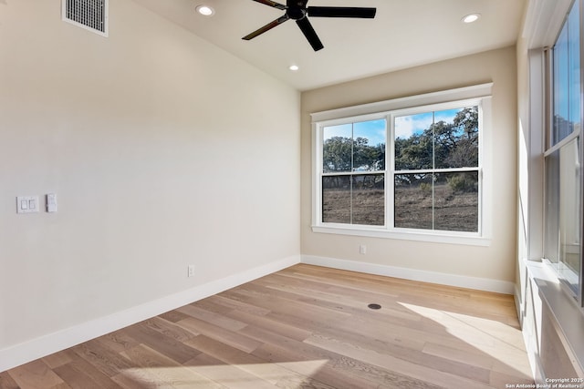 unfurnished room featuring recessed lighting, a ceiling fan, visible vents, and light wood-type flooring