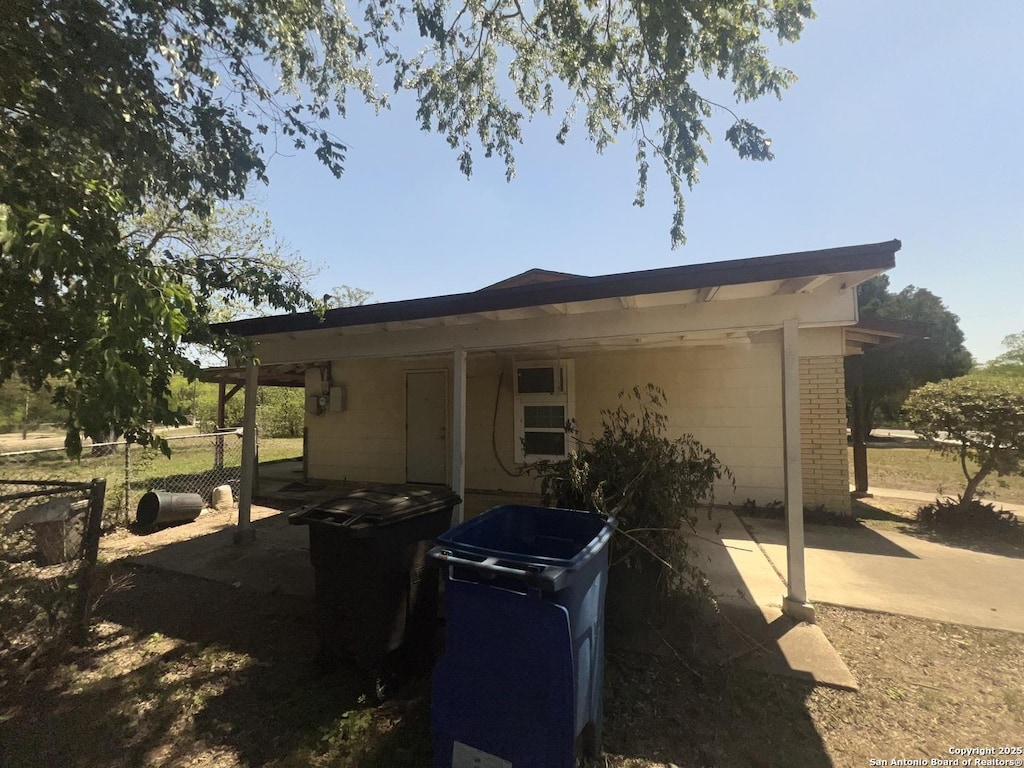 view of home's exterior with fence