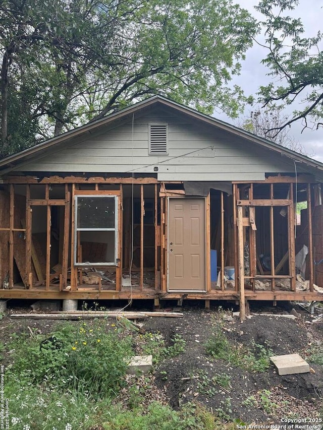 back of house with a sunroom
