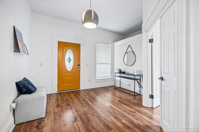 entrance foyer with baseboards and dark wood-style floors