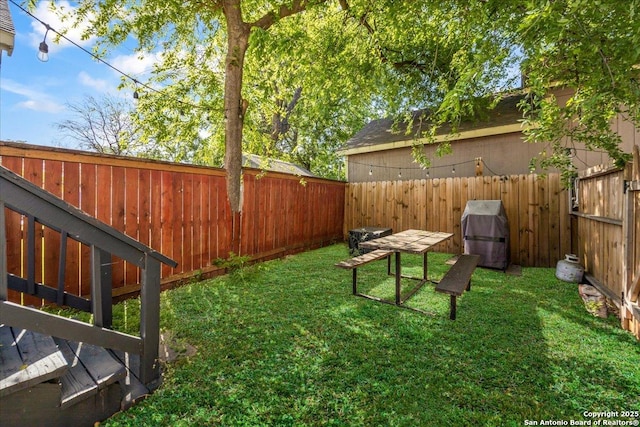 view of yard with a fenced backyard