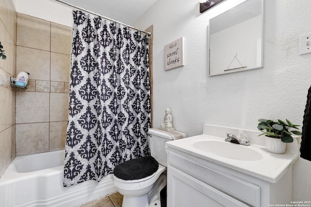 bathroom with vanity, toilet, tile patterned flooring, a textured wall, and shower / bath combination with curtain