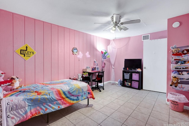 bedroom with ceiling fan, light tile patterned flooring, and visible vents