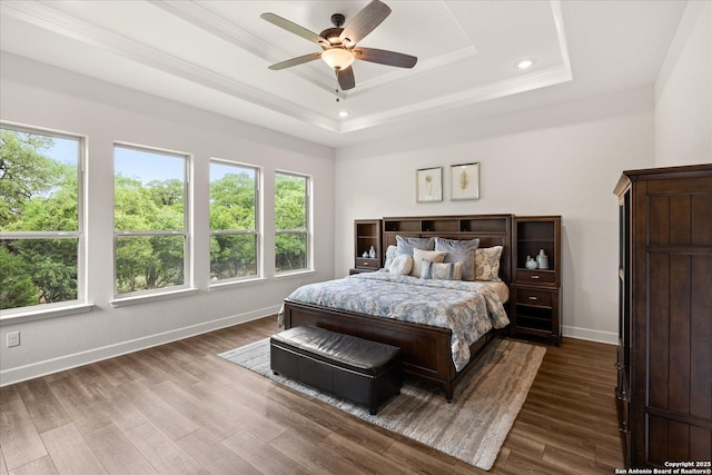 110 Madrone Trl, Boerne, TX 78006 - bedroom with crown molding, baseboards, a raised ceiling, and dark wood-style flooring