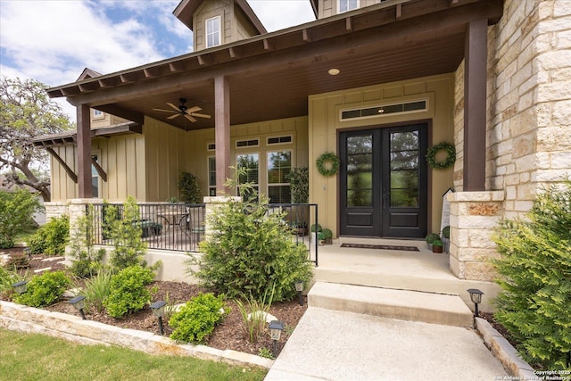 110 Madrone Trl, Boerne, TX 78006 - property entrance with french doors, board and batten siding, ceiling fan, and covered porch