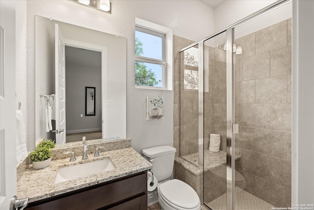 110 Madrone Trl, Boerne, TX 78006 - bathroom with toilet, vanity, and a stall shower