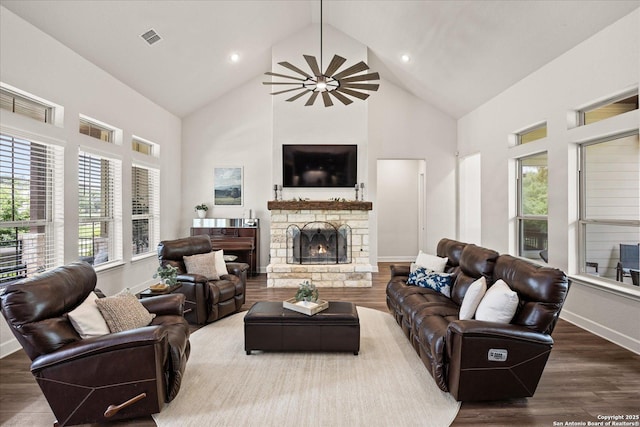 110 Madrone Trl, Boerne, TX 78006 - living room with high vaulted ceiling, plenty of natural light, wood finished floors, and a fireplace