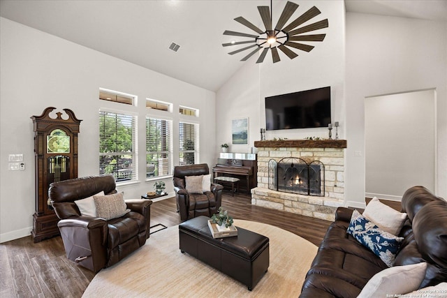 110 Madrone Trl, Boerne, TX 78006 - living area with wood finished floors, visible vents, baseboards, a fireplace, and high vaulted ceiling