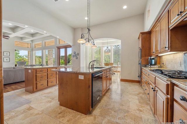 4001 Bell Springs Rd, Dripping Springs, TX 78620 - kitchen featuring black dishwasher, a high ceiling, a center island with sink, and recessed lighting
