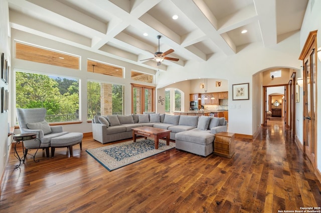 4001 Bell Springs Rd, Dripping Springs, TX 78620 - living area with arched walkways, dark wood-style flooring, recessed lighting, beamed ceiling, and ceiling fan