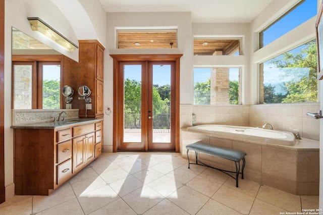 4001 Bell Springs Rd, Dripping Springs, TX 78620 - interior space featuring a bath, french doors, vanity, and tile patterned flooring