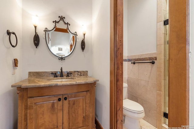 4001 Bell Springs Rd, Dripping Springs, TX 78620 - bathroom featuring tile walls, vanity, and toilet
